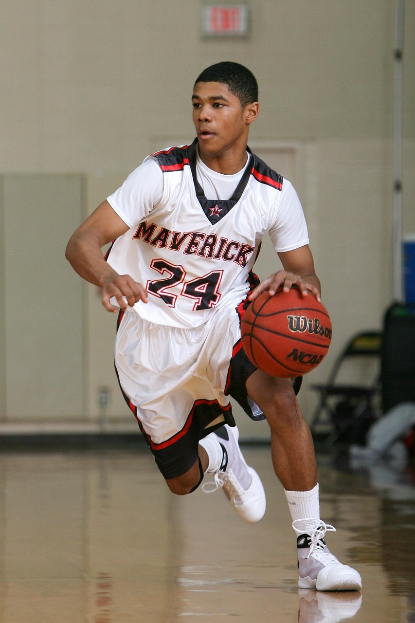 Basketball player dribbling during a youth basketball game