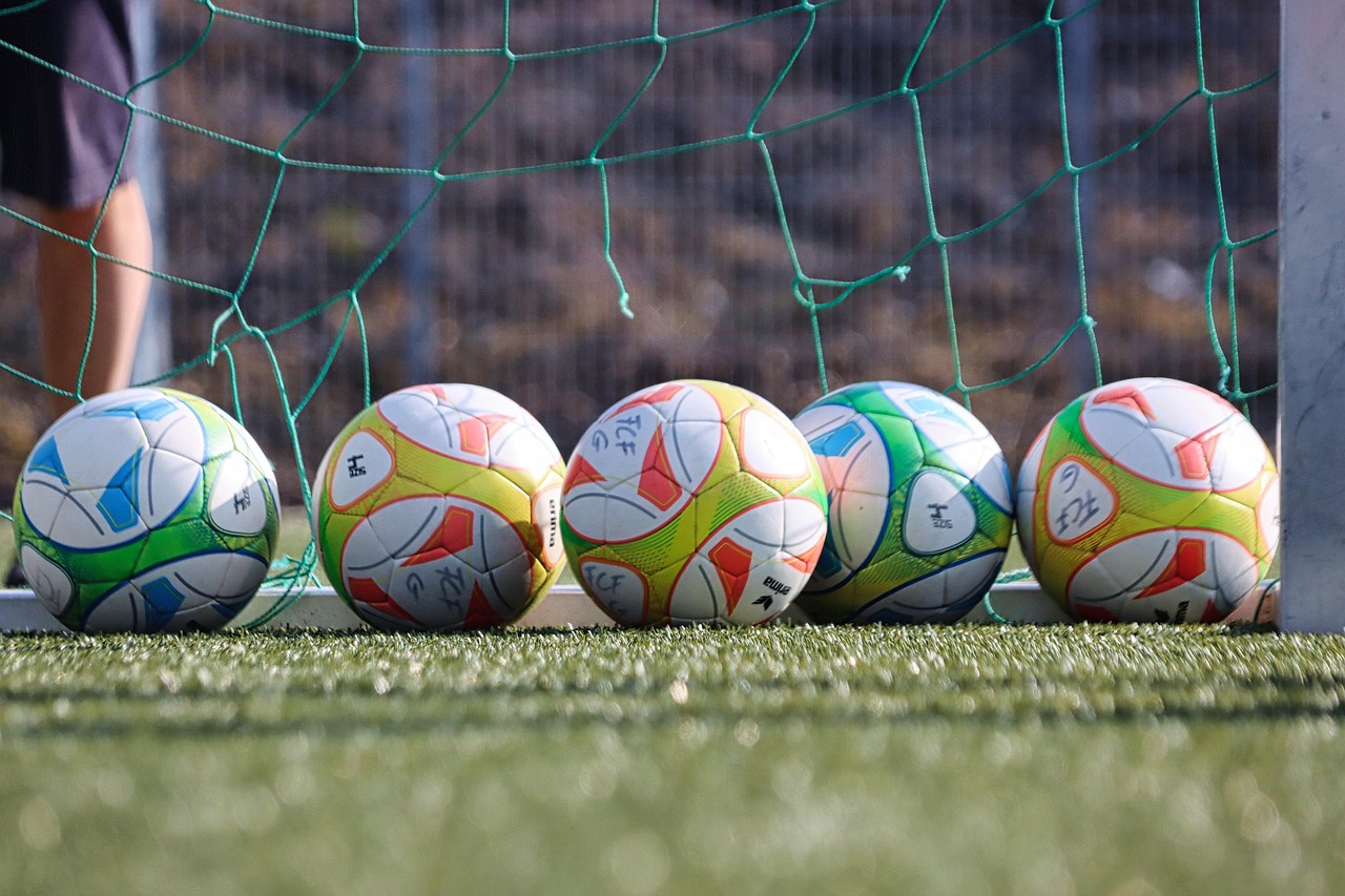 Soccer balls set up on a practice field