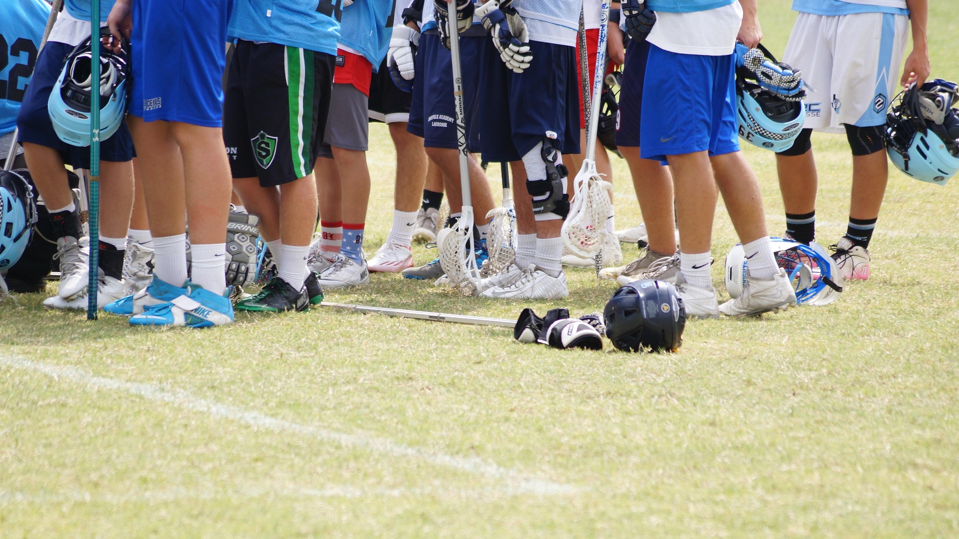 Youth lacrosse athletes working through a structured practice session