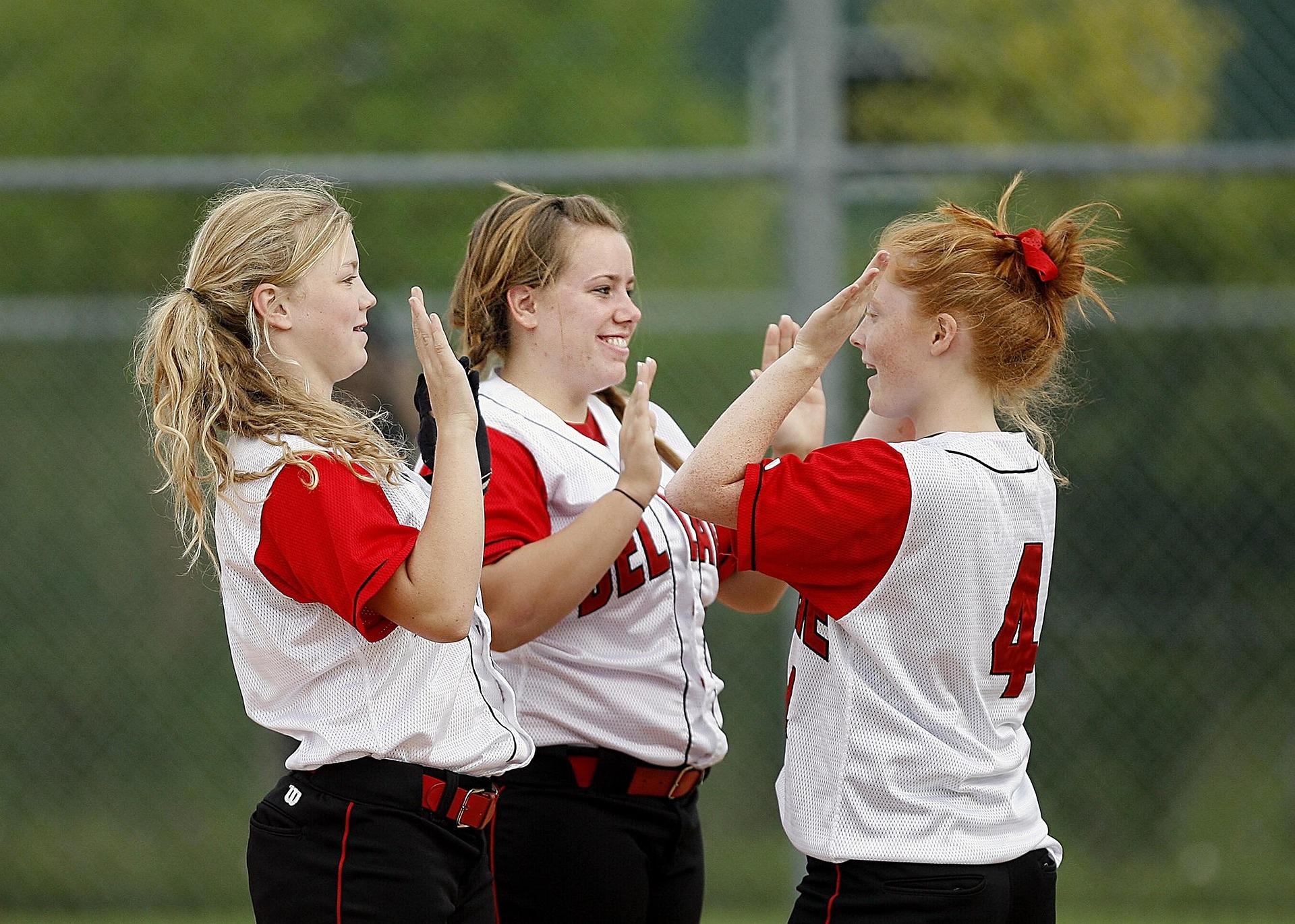 Young softball athletes staying engaged during practice