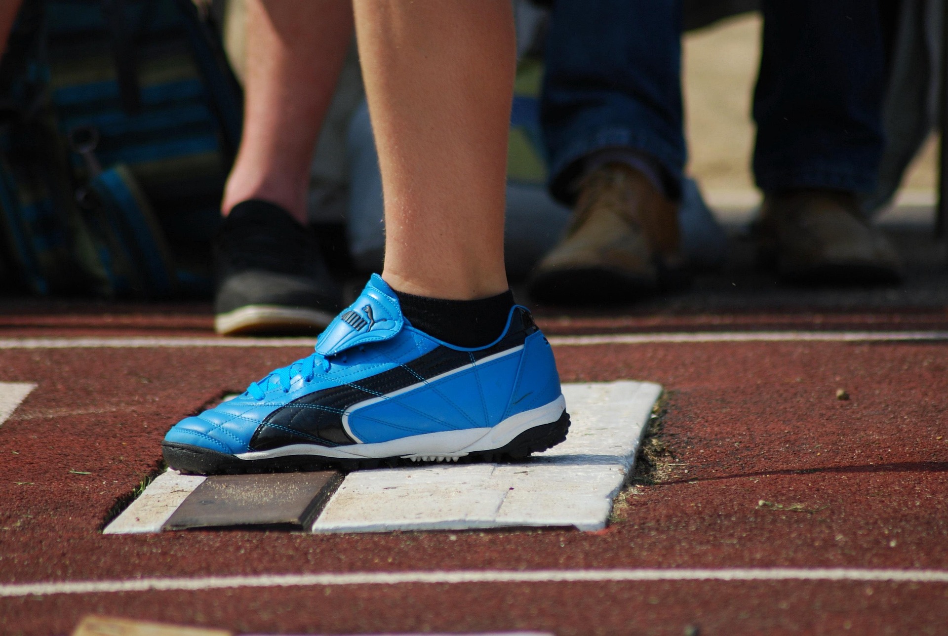 Youth track and field athletes working through a structured practice session